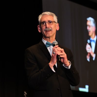 Photo of Craig hosting the Texas School Public Relations Association State Awards Banquet