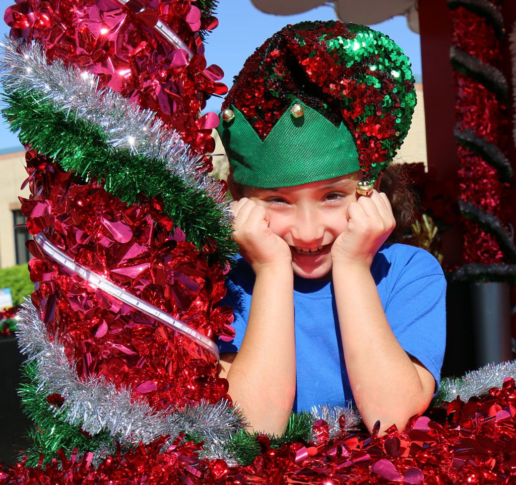 Student Elf in a Christmas float.