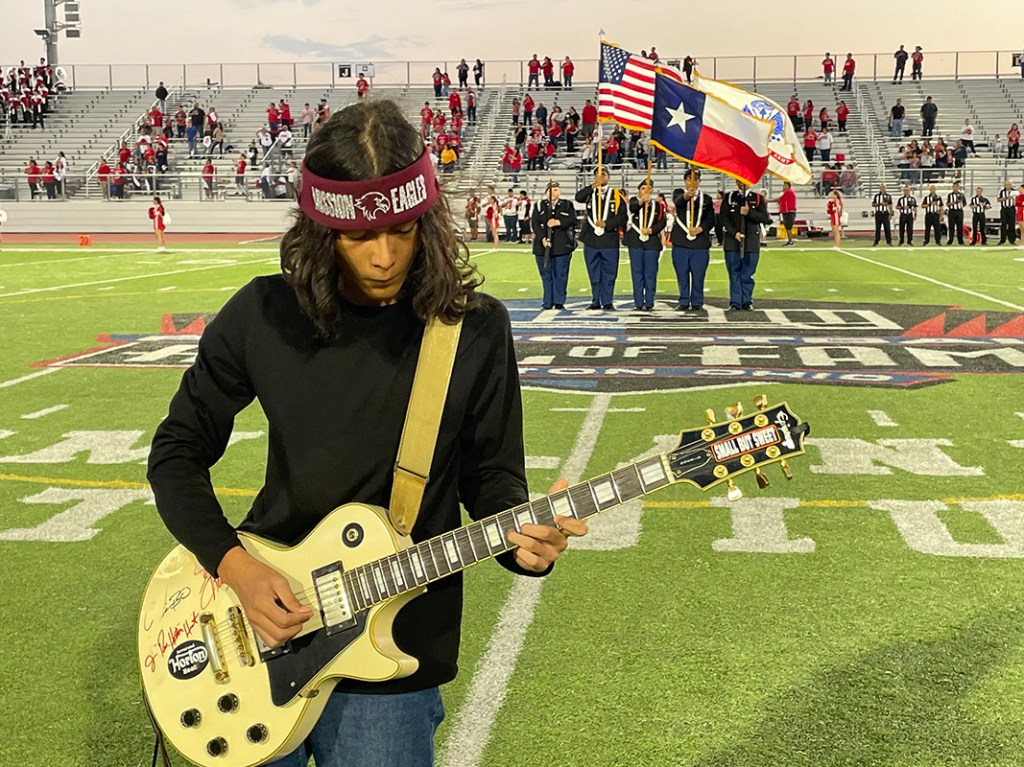 Special guitar performer for the National Anthem at a football game.